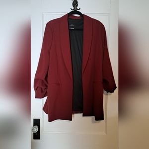 Stretchy maroon blazer with rusched sleeve detail and false pockets